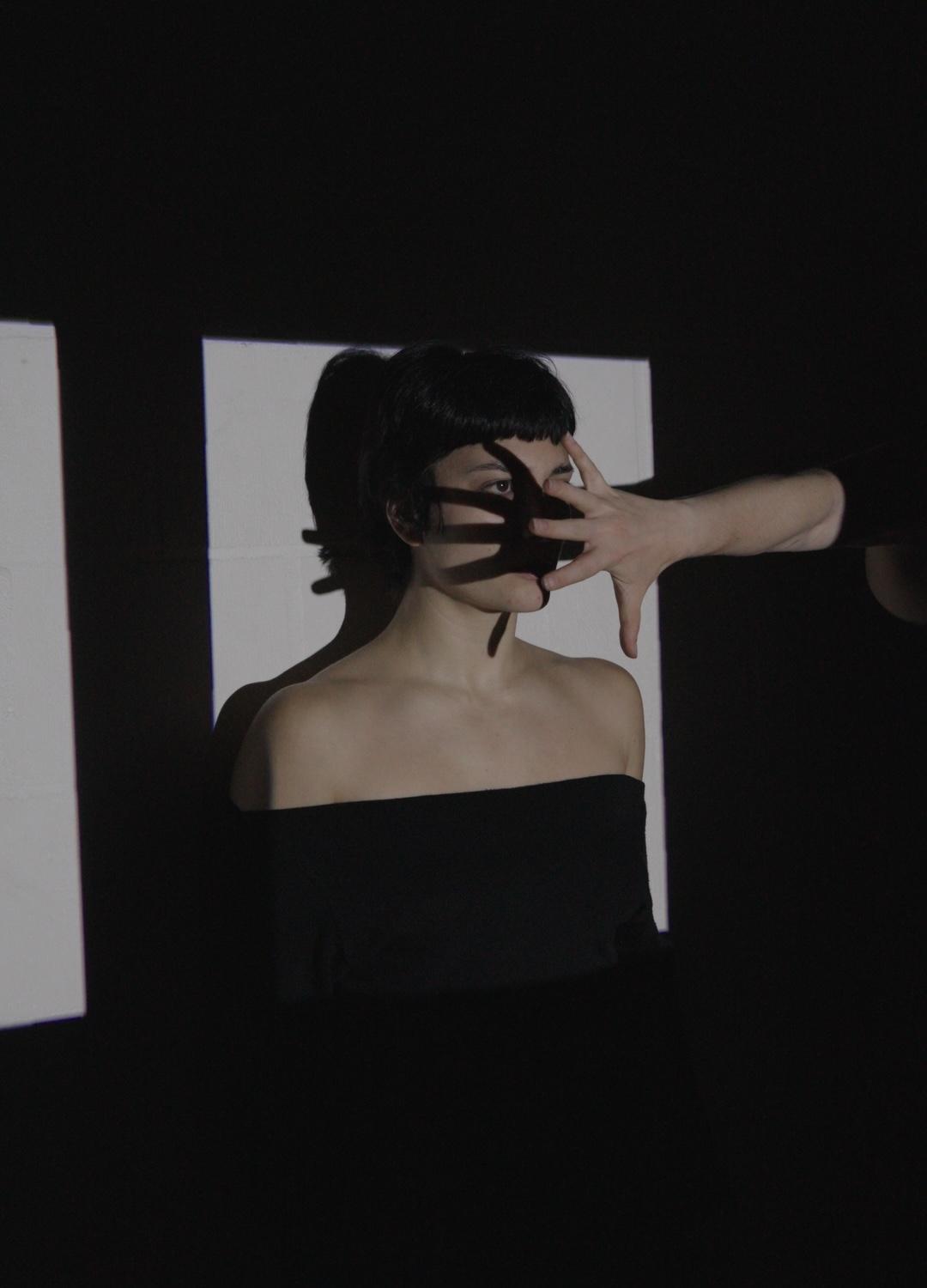 A dancer interacting with projected imagery in The Winding Snake.