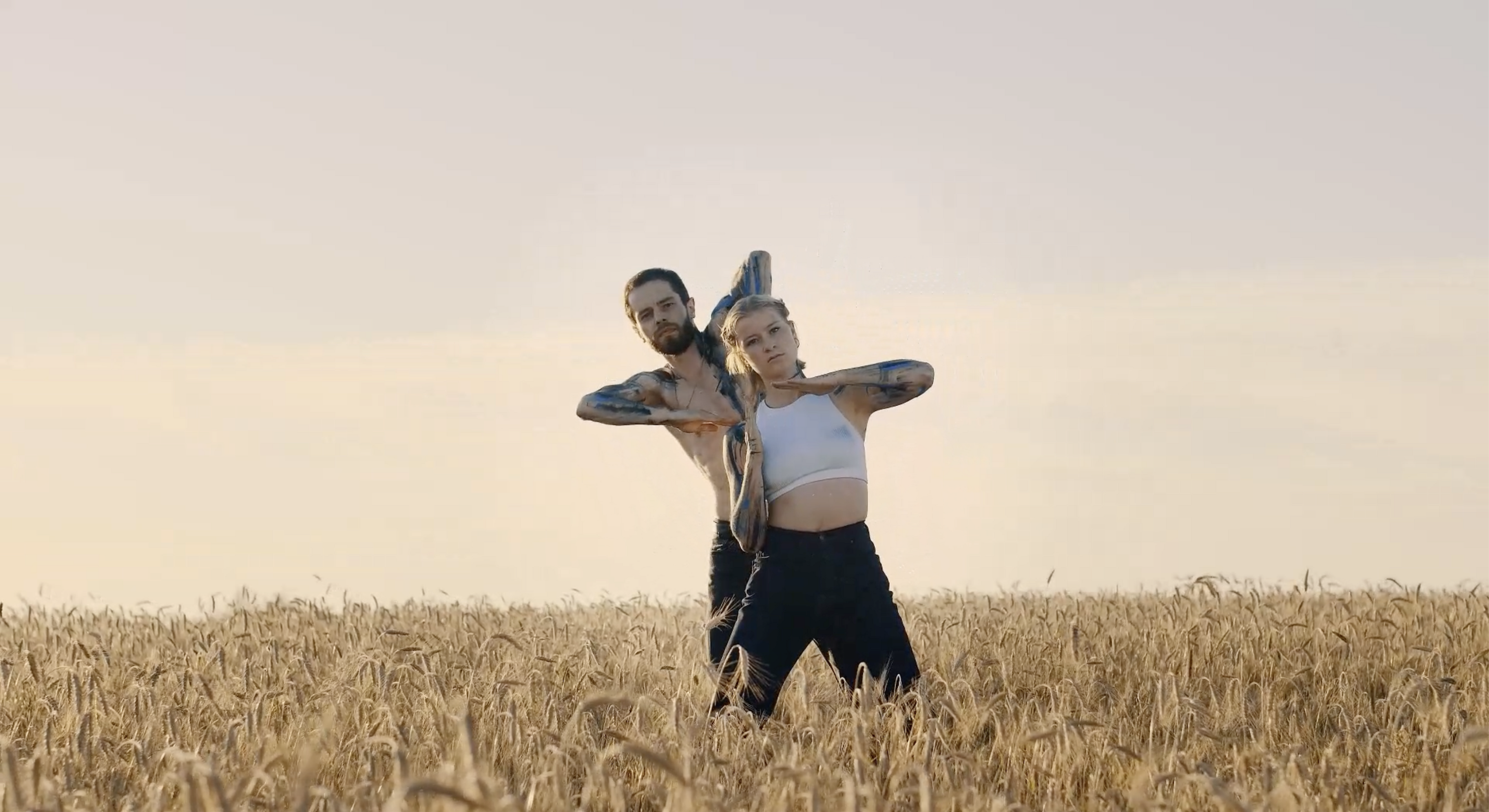 Yamuna and Denis in a field of grain